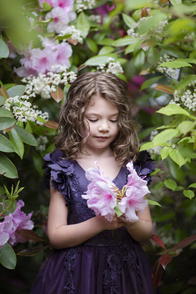 Child surrounded by flowers