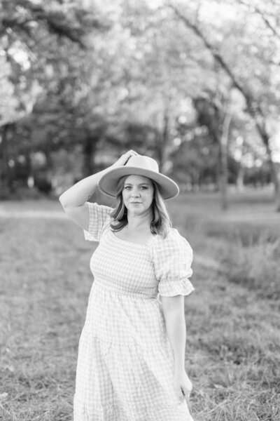 wedding photographer holding hat