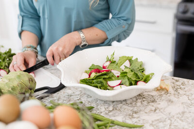 Amy prepping a salad