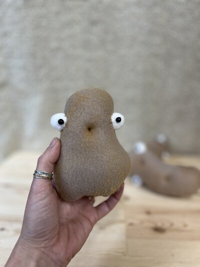 Natalie holding Fabric animal sculpture