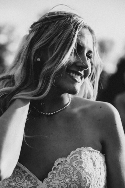 Black and white photo of a beautiful bride smiling