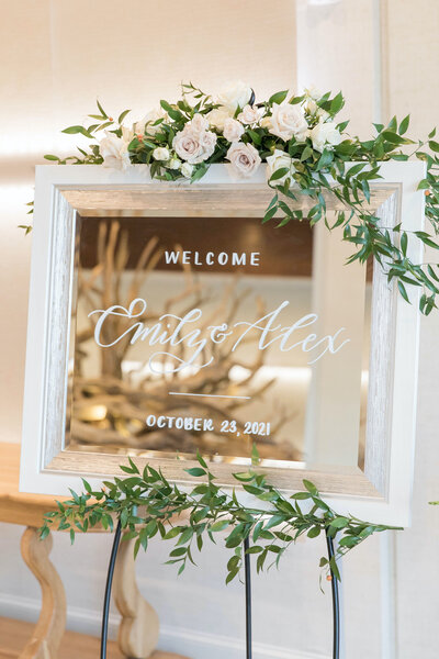 White  wood welcome mirror with white handlettering for Cape Cod wedding