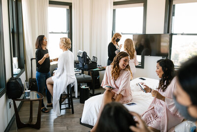 Bride and bridesmaids getting makeup done 
