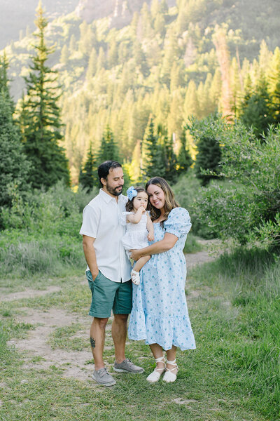 A peaceful family enjoying time together in the Utah mountains, showcasing Iris Graciela’s love for natural, relaxed lifestyle imagery. Photo by another photographer, featured by South Jordan Newborn Photographer Iris Graciela.