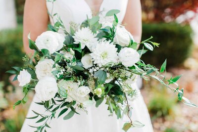 bride holding bouquet, white flowers wedding bouquet