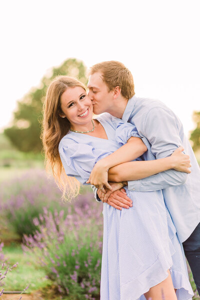 couple kiss in lavender field in Missouri