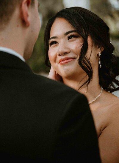 Elopement and wedding photographer in Austin gently poses bride and groom for portraits
