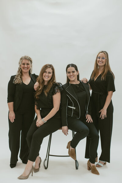 four women smiling