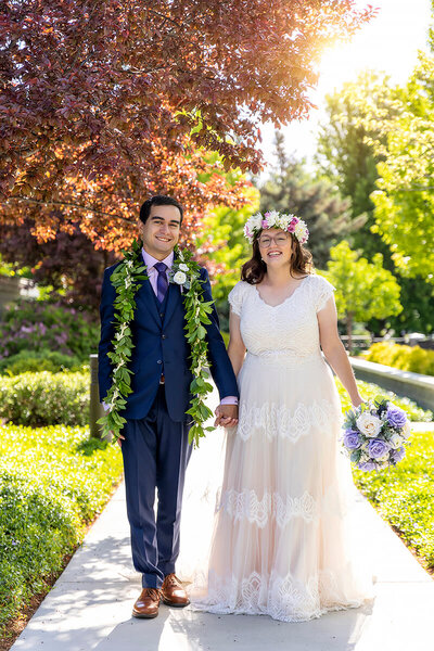 Couple in white dress and navy blue suit in Spokane wa
