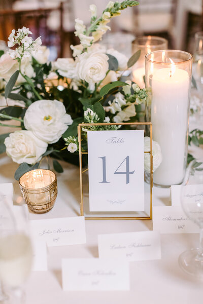 Sophisticated wedding reception decor featuring a stunning combination of white and blush floral arrangements by Leigh Florist.