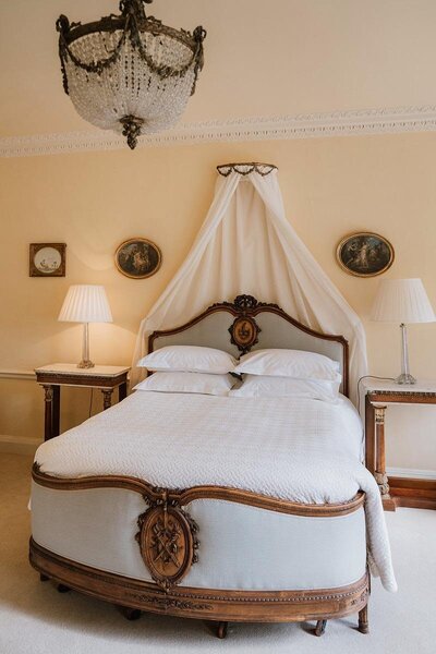 Bed at cam house manor for wedding guests