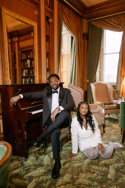 bride and groom sat on floor of The Lanesborough hotel floor