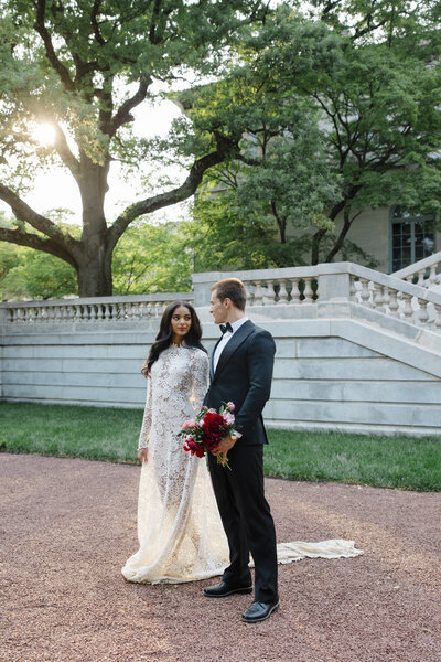 Bride and groom walk up memorial steps at their DC wedding