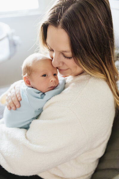 Mom cuddling baby during Wheaton, IL newborn session.
