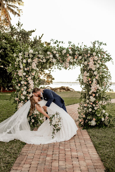 Florida Wedding Ft Myers Wedding Photographer Destination wedding photographer and videographer Floral arch
