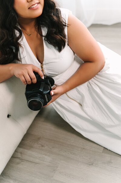 Lyn looking away sitting down