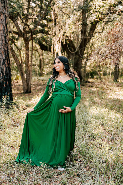 Mom-to-be in a blue dress for her maternity session in Winter Park, FL