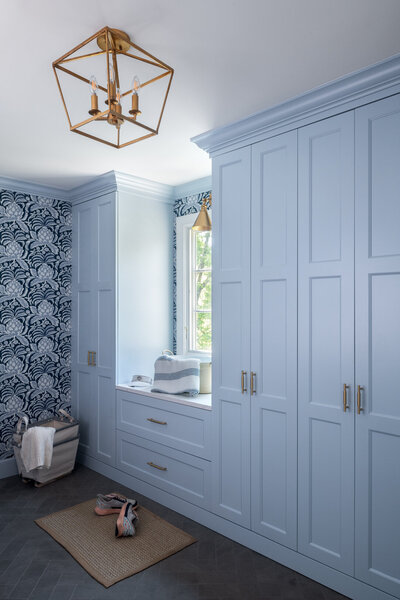light blue/blush laundry room with cabinets