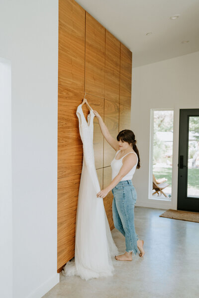 getting ready moments bride and her dress