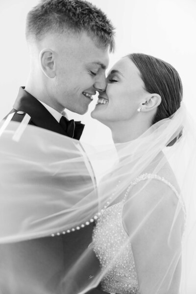 Man escorts woman down the stairs of a beautiful and luxurious wedding venue in Indiana