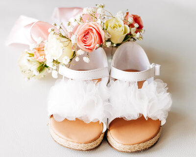 Wedding detail photo little girl shoes and flowers