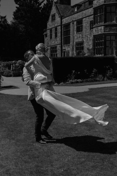 Newlyweds dancing outside Salt House surrounded by summer light and laughter