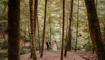 couple captured under a waterfall by birmingham alabama wedding photographer