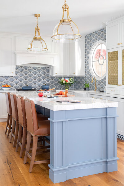 bright blue and white kitchen with shell wallpaper