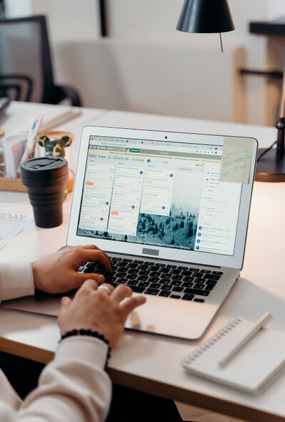 White laptop used for managing an ad campaign project, highlighting a free Google Ads account audit, emphasizing the tools and process involved in optimizing Google Ads performance.