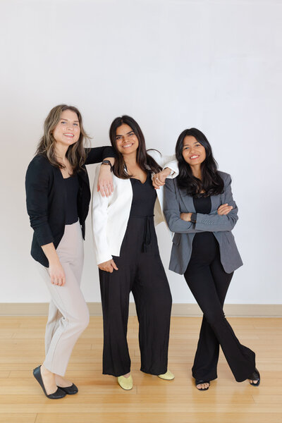 Three professional pelvic and sports physiotherapists, wearing blazers, at Harmony Physiotherapy and Wellness, Ottawa