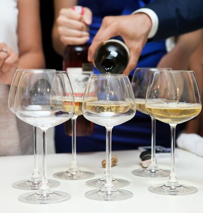 Champagne being poured into glasses at a celebration