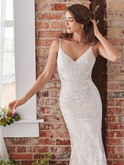 Sleeveless Ball Gown Wedding Dress. Be true to classic in a sleeveless ball gown wedding dress. Elegant lace motifs and a flattering silhouette ensure a subtle yet captivating look for your big day.