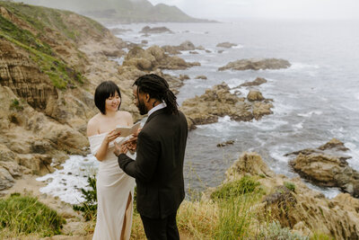 black and white image bride and groom  kissing