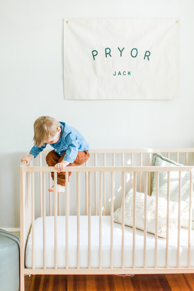 toddler jumping on bed