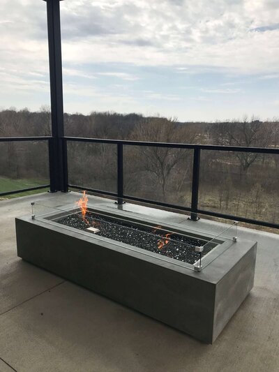 Extra large rectangular  concrete fire pit table with glass windscreen