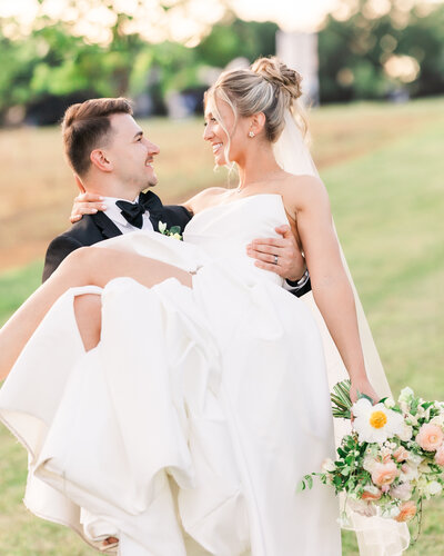 Bride and Groom portrait smiling at eachother