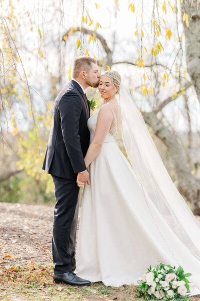 Man escorts woman down the stairs of a beautiful and luxurious wedding venue in Indiana