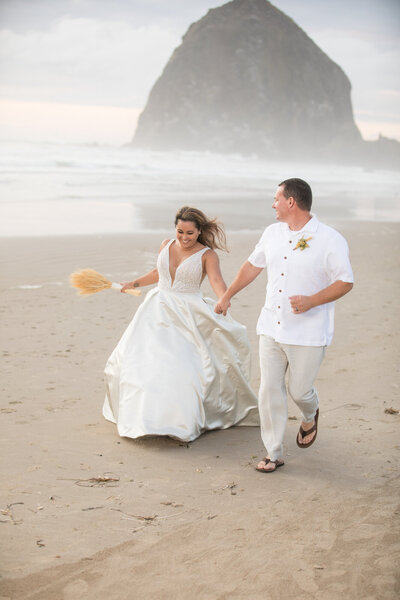 Wedding couple in front of hay stack  rock