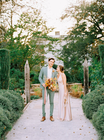 Fall wedding ceremony in a South Carolina forest with a foraged floral arch