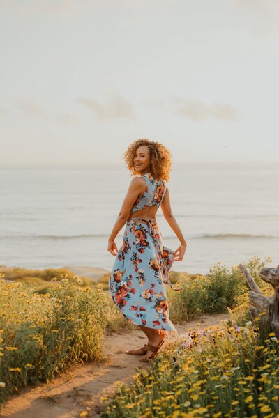 San Diego Senior Photo Shoot at Sunset cliffs point loma PLNU  graduation beach ocean cliffs senior photography san diego senior portrait photographer - PLNU SDSU UCSD USD with flowers superbloom wildflowers cliffs
