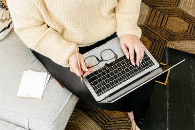 Client in virtual therapy session on laptop