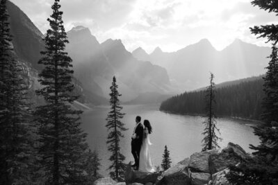 Bride and groom standing in front of mountains