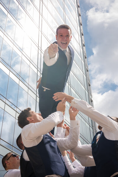 groom lifted by groomsmen, captured by Indianapolis wedding photographer
