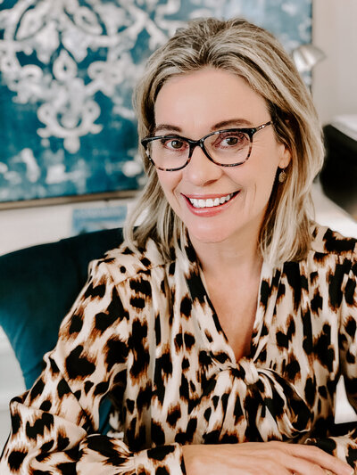 Portrait of a woman in a leopard blouse