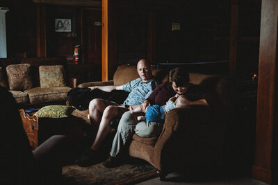 Mom nursing infant on couch - relaxed in home family photography