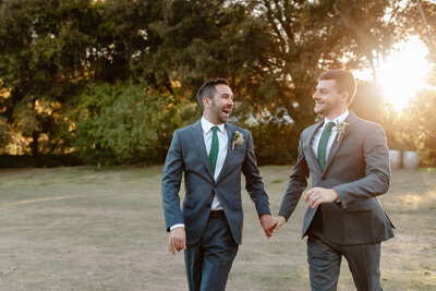 Groom and groom holding hands