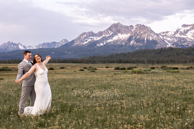 Bride and Groom exchanging vows face to face on a ridge in Sawtooth Mountains