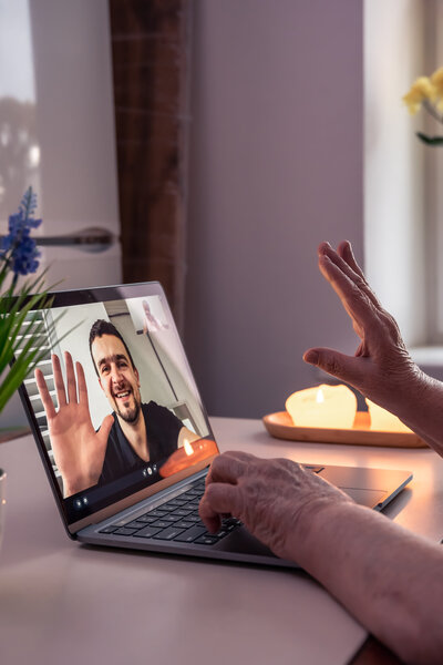 A woman on a video call with a client.