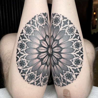 Two views of a color tattoo of a mandala flower with stem and leaves.
