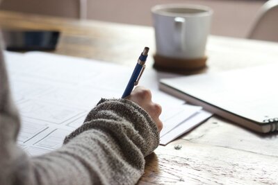 Writing on desk with coffee